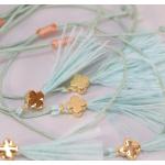Bracelets plume pour la communion vert pastel en lot de 10 pour fille 
