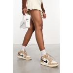 Baskets montantes Nike Air Jordan 1 blancs cassés en cuir à lacets Pointure 44 look casual pour femme 
