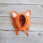 Bonnets en mailles orange pour bébé de la boutique en ligne Etsy.com 