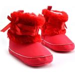 Bottes de neige & bottes hiver  rose bonbon à motif papillons look fashion pour fille 