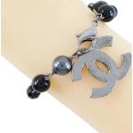 Bracelets de créateur Chanel noirs en métal seconde main look fashion pour femme 