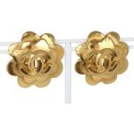 Boucles d'oreilles de créateur Chanel jaunes en métal seconde main look vintage 