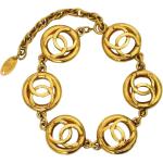 Bracelets breloques de créateur Chanel jaunes en métal seconde main look vintage pour femme 