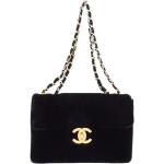 Besaces vintage de créateur Chanel noires en daim seconde main look vintage pour femme 
