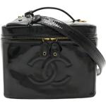 Besaces vintage de créateur Chanel noires en cuir verni seconde main look vintage pour femme 