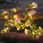 Guirlandes lumineuses roses à motif fleurs 