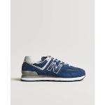 Baskets basses New Balance 574 bleues look casual pour homme 