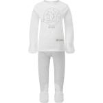 Pyjamas blanc crème à rayures en coton pour bébé de la boutique en ligne Etsy.com 